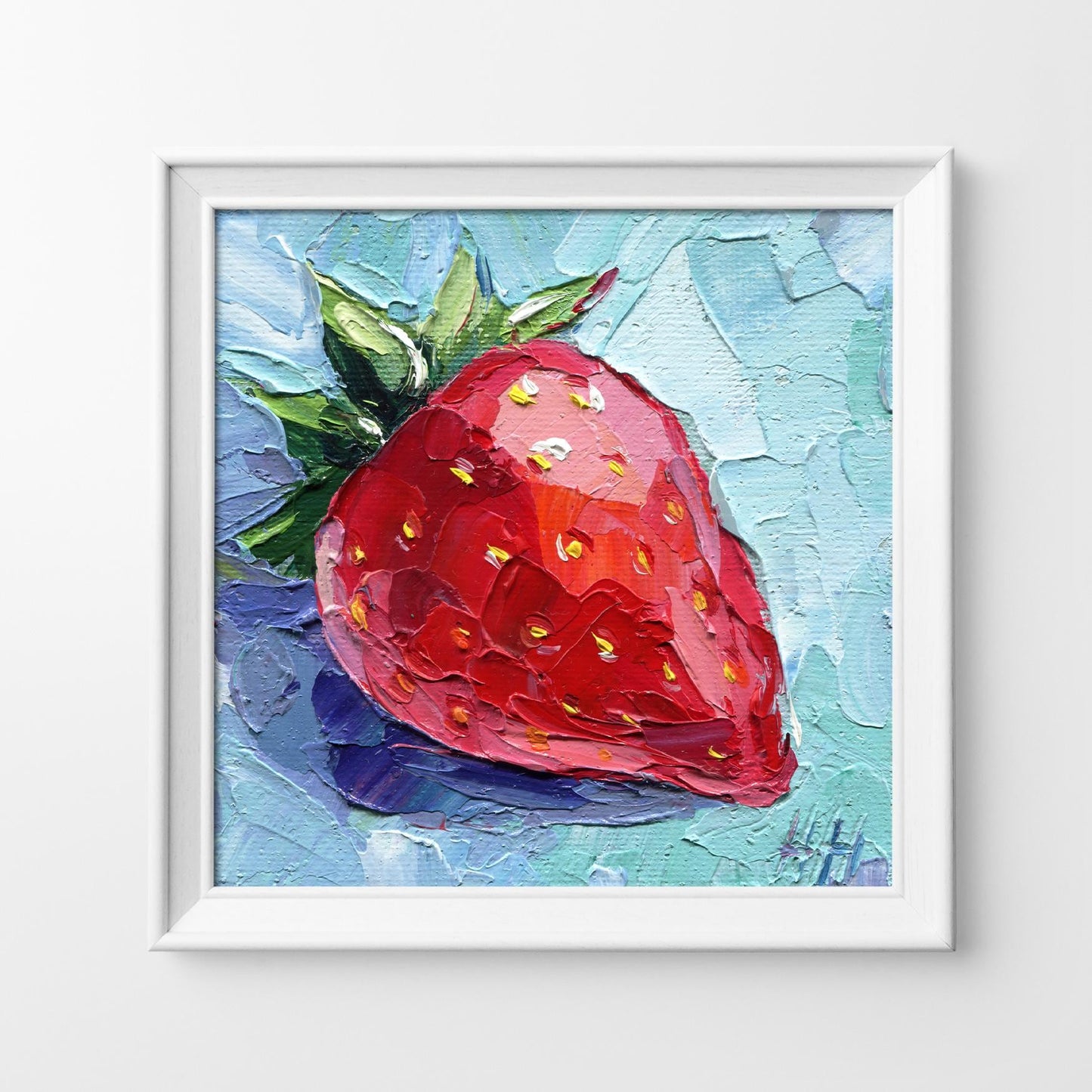 Strawberry oil painting by Hanna Hryharenka displayed in kitchen setting, showing how the small 4x4 inch textured artwork adds a pop of color to counter or shelf space, original fruit art as home decor