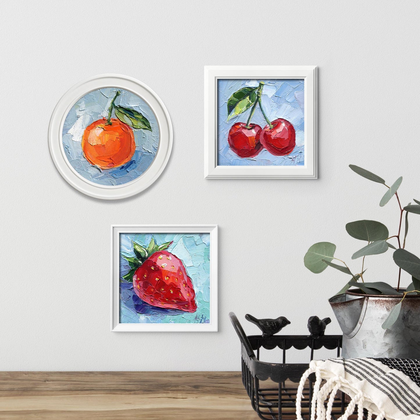 Side angle of strawberry impasto painting by Hanna Art highlighting the three-dimensional texture and layered oil paint technique, showing the depth and richness of the red fruit against blue, small 4x4 inch canvas