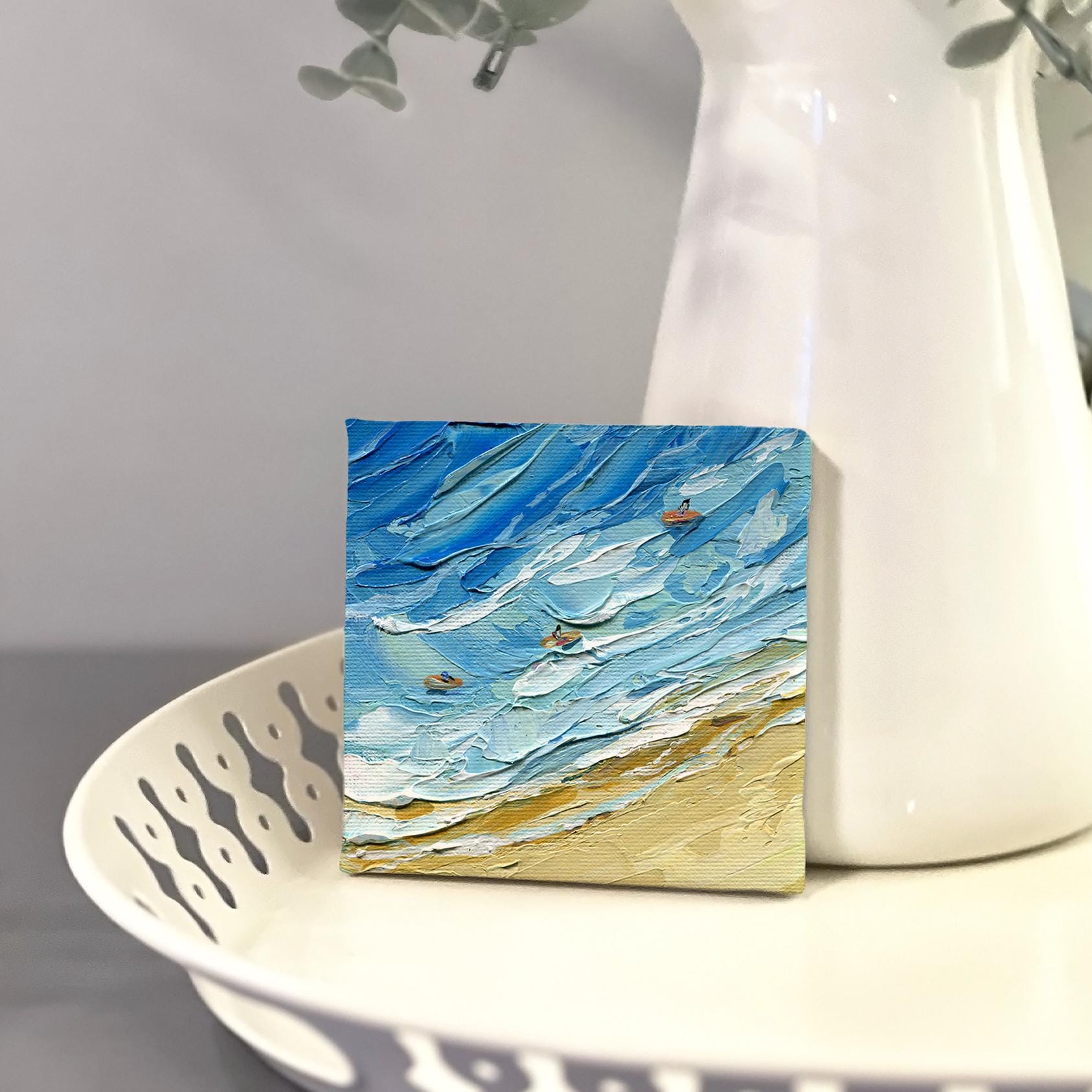 Side angle view of ocean impasto painting by Hanna Hryharenka highlighting the three-dimensional texture and layered palette knife technique that brings the crashing waves to life, signature Hanna Art style