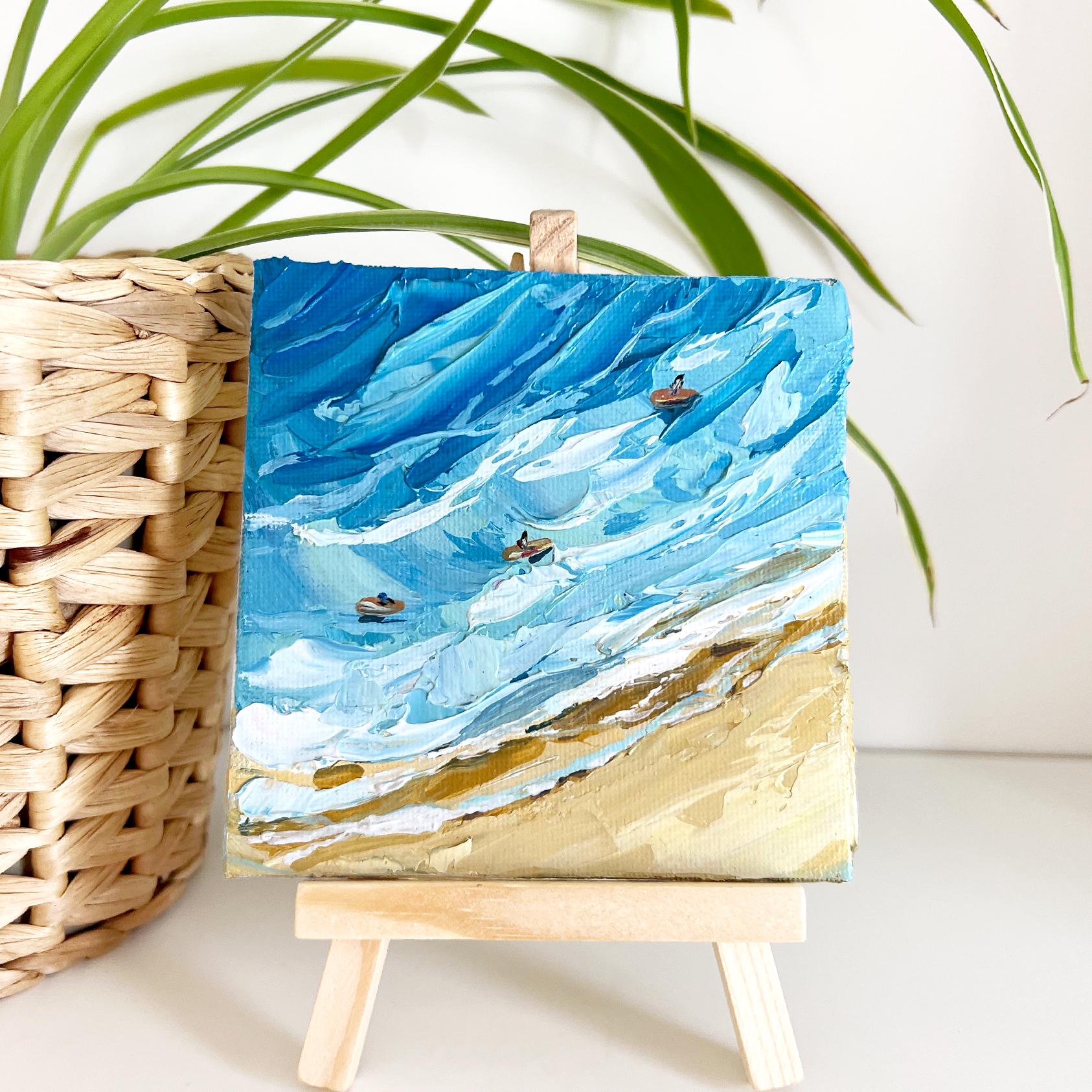 Hanna Hryharenka's beach surf oil painting displayed in coastal-themed interior, showing how this original Hanna Art textured blue seascape artwork enhances room decor as statement wall art