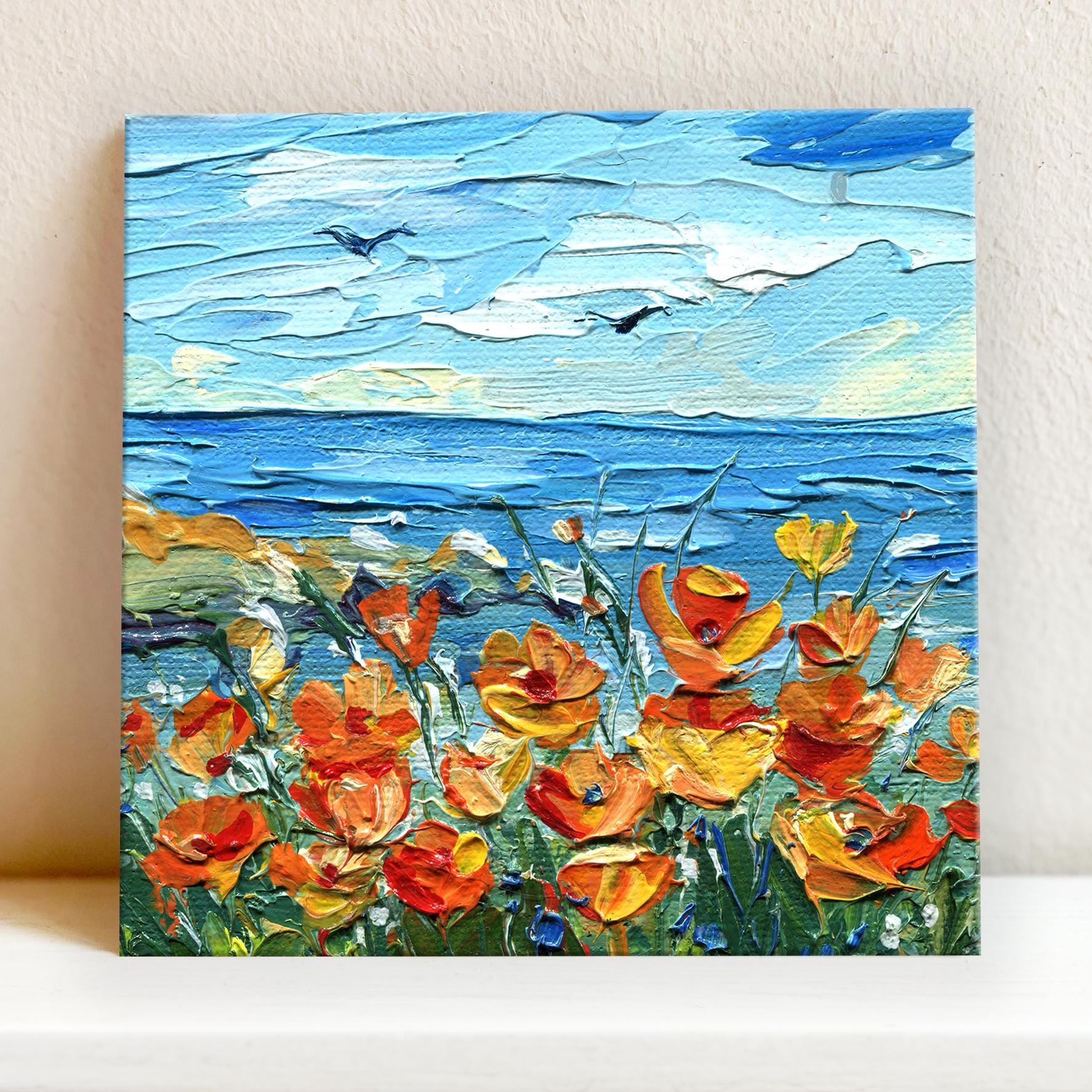 Detailed view of California poppy seascape creation by Hanna Art displaying intricate palette knife work and luminous tangerine blossoms dancing against cerulean ocean backdrop, embodying the essence of West Coast beauty